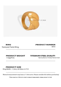 Macro detail of gold plated twisted titanium steel ring showing 1.5cm width and texture