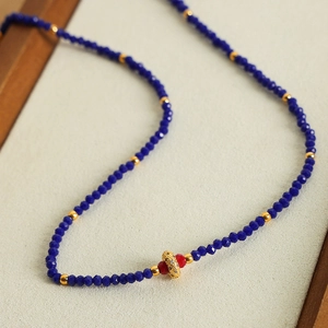 Vintage style faceted natural stone beaded necklace with gold drill sphere and red accents
