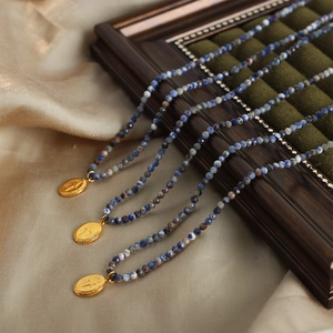 Vintage gold oval pendant necklace with handmade blue and white natural stone beads