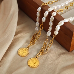 Baroque pearl necklace with gold Elizabeth II coin pendant on champagne silk satin