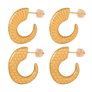 Golden C-shaped earrings with geometric spiral and honeycomb mesh texture in titanium steel