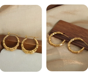 Detail of 18k gold plated titanium steel U-shaped earrings with bamboo joint texture