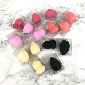 Set of multi-colored makeup sponges in waterdrop and teardrop shapes with clear boxes