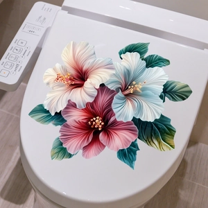Detail of colorful hibiscus floral stickers with green leaves on a white toilet lid