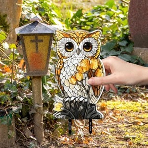 Close-up of owl garden stake in stained glass style showing size and vibrant colors