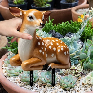 Detailed realistic deer garden stake decor shown in a succulent plant pot for scale