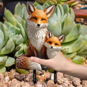 Detail view of fox mother and pup garden stake with double stakes for outdoor decor