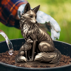 Artistic bronze-finished fox parent and cub sculptures for garden and patio decor