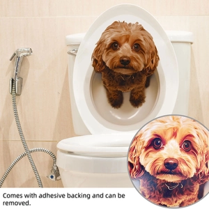 Detail of 3D brown puppy sticker with adhesive backing applied on a toilet lid
