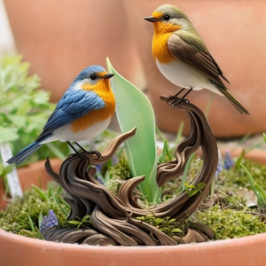 Detailed view of lifelike bird figurines on a spiral wood base in a garden pot