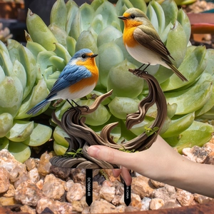 Detailed garden stake featuring vibrant resin birds and a realistic wood branch base