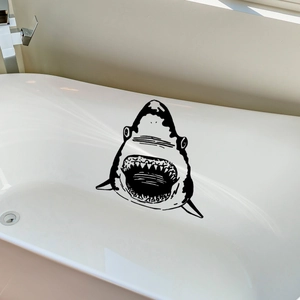 Minimalist hand-drawn black shark wall sticker applied to a white bathtub interior