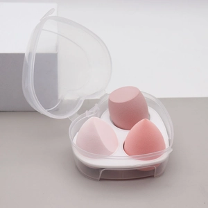 Three-piece pink makeup sponge set with teardrop shapes in a heart-shaped storage box