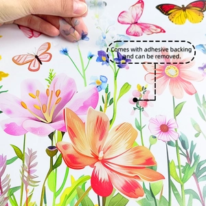 Detail of hand peeling colorful floral butterfly wall decal with adhesive backing