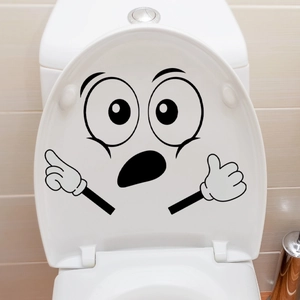 Detailopname van grappige cartoon verrassingsgezicht muursticker op badkamertegels