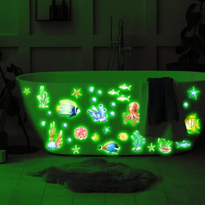Luminous ocean creature wall stickers showing glowing octopus and fish on bathtub
