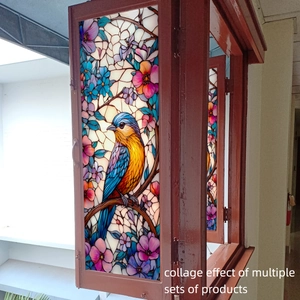 Detail of vintage bird and floral stained glass window film with vibrant colors