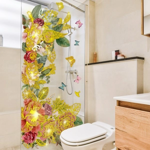 Floral wall decal with realistic red roses and golden butterfly accents on bathroom glass