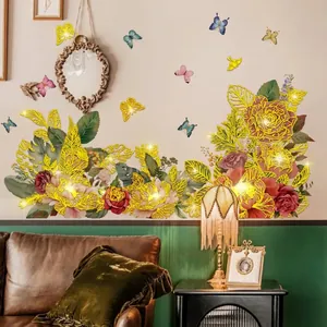 Floral wall stickers with gold-rimmed roses, tropical leaves and butterflies for home decor