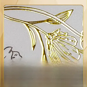 Macro detail of gold foil flower wall sticker with elegant metallic texture finish
