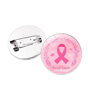 Detailed view of pink ribbon breast cancer awareness badge with floral and butterfly design