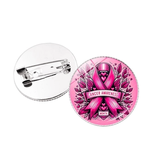 Front and back detail of pink ribbon cancer awareness badges with secure safety pins