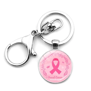 Detail of pink ribbon breast cancer awareness keychain with floral wreath and metal lobster clasp