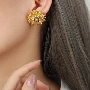 Golden sunflower earrings with zircon stones and leaf texture in stainless steel