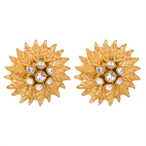 Golden sun flower stud earrings with zirconia stones and textured petals on white background