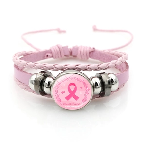 Close-up of pink leather bracelet featuring Breast Cancer Awareness ribbon charm