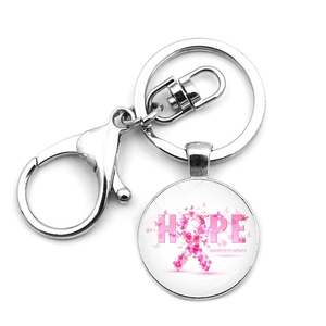 Detailed view of metal keychain with pink ribbon Hope Awareness Month pendant