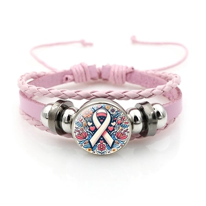Detail of pink breast cancer awareness leather bracelet with ribbon glass cabochon