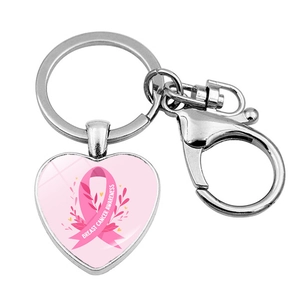 Detail of heart keychain with pink ribbon breast cancer awareness symbol and lobster clasp