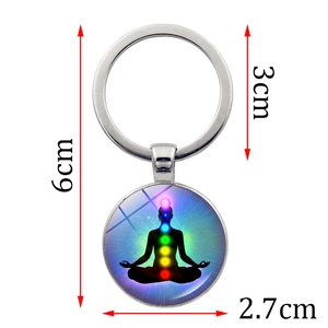 Portachiavi meditazione yoga con 7 simboli chakra e ciondolo in vetro blu sfumato