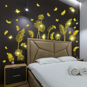 Golden tropical leaves and butterflies wall stickers for a luxury bedroom decoration