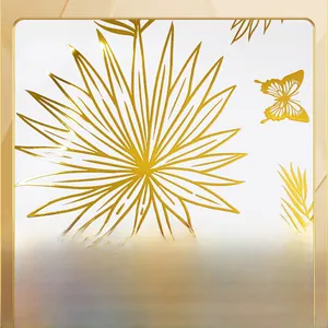 Macro view of hot stamping palm leaves and butterfly wall stickers with metallic gold finish