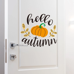 Close-up of Hello Autumn pumpkin wall sticker on a white door for seasonal home decor