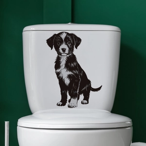 Realistic black and white puppy wall decal applied to a white bathroom toilet tank