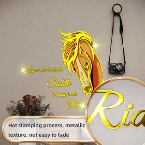 Detail of golden horse wall decal with hot stamping texture and motivational quote