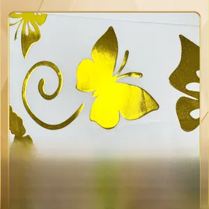 Detail showing hot stamping process on golden butterfly wall stickers with metallic texture
