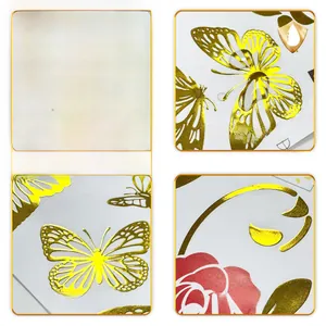 Detailed macro view of waterproof gold foil rose and butterfly stickers with 3D texture