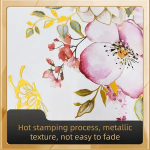 Detailed macro view of floral wall decals featuring gold foil butterflies and petals