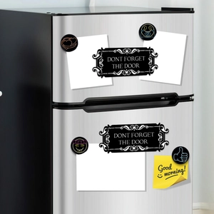 Magnetic fridge stickers set with black reminders and emojis on stainless steel door