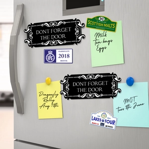 Set of 2 black magnetic fridge stickers with Don't Forget The Door reminder text