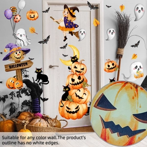 Detail of Halloween wall stickers with witch and pumpkin designs on a modern home wall