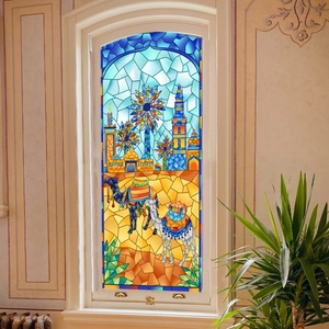 Close-up of stained glass window film featuring Middle Eastern camel and desert landscape