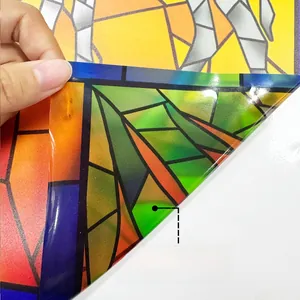 Detail showing double-sided colorful hand-painted camel window sticker with vibrant patterns