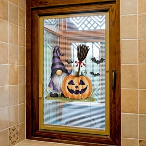 Halloween window clings featuring cartoon gnomes, pumpkins and bats on a glass window pane