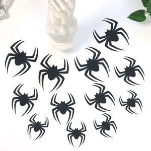 Detail of multi-size black 3D spider wall decals with a matte finish for Halloween decor