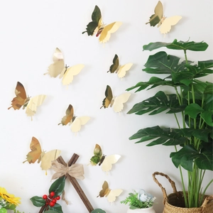 Detailed 3D gold mirror butterfly wall stickers in various sizes for home decoration
